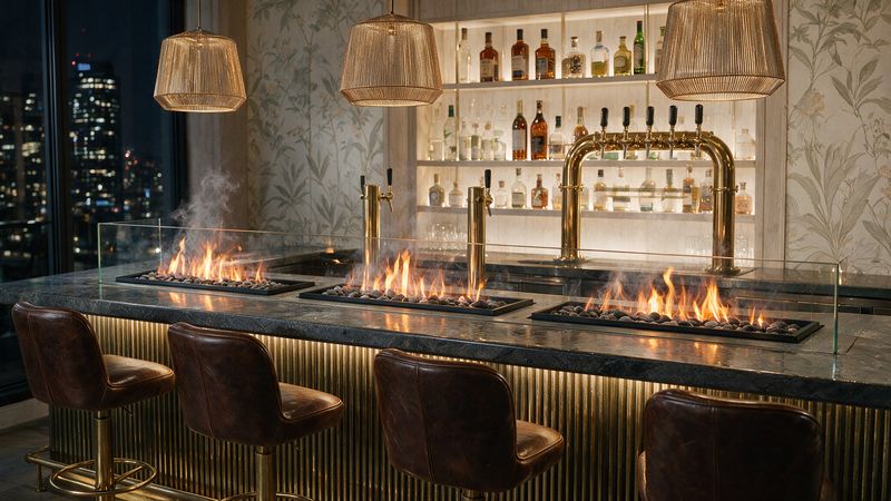Concept render, not a photograph: three water-vapour fire trays in glass guards along a dark bar top with brass taps and a backlit shelf of bottles, city lights in the window.