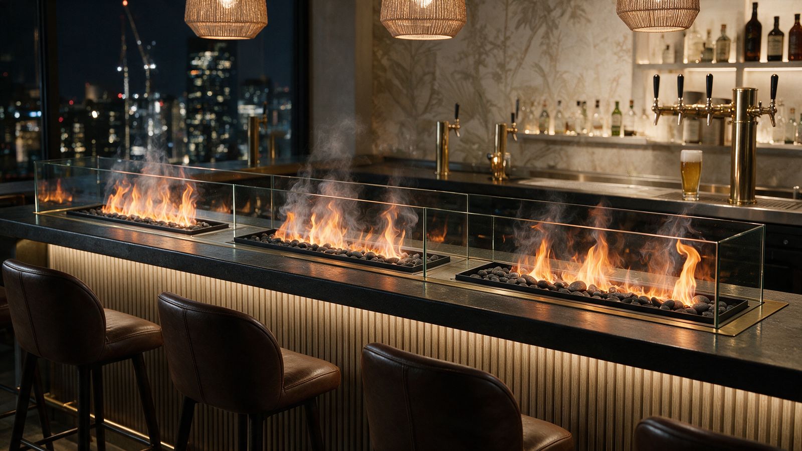 Concept render, not a photograph: three 20-inch water-vapour fire trays in a row along a dark stone hotel bar top with low glass guards on the guest side, leather stools and a backlit bottle shelf behind.